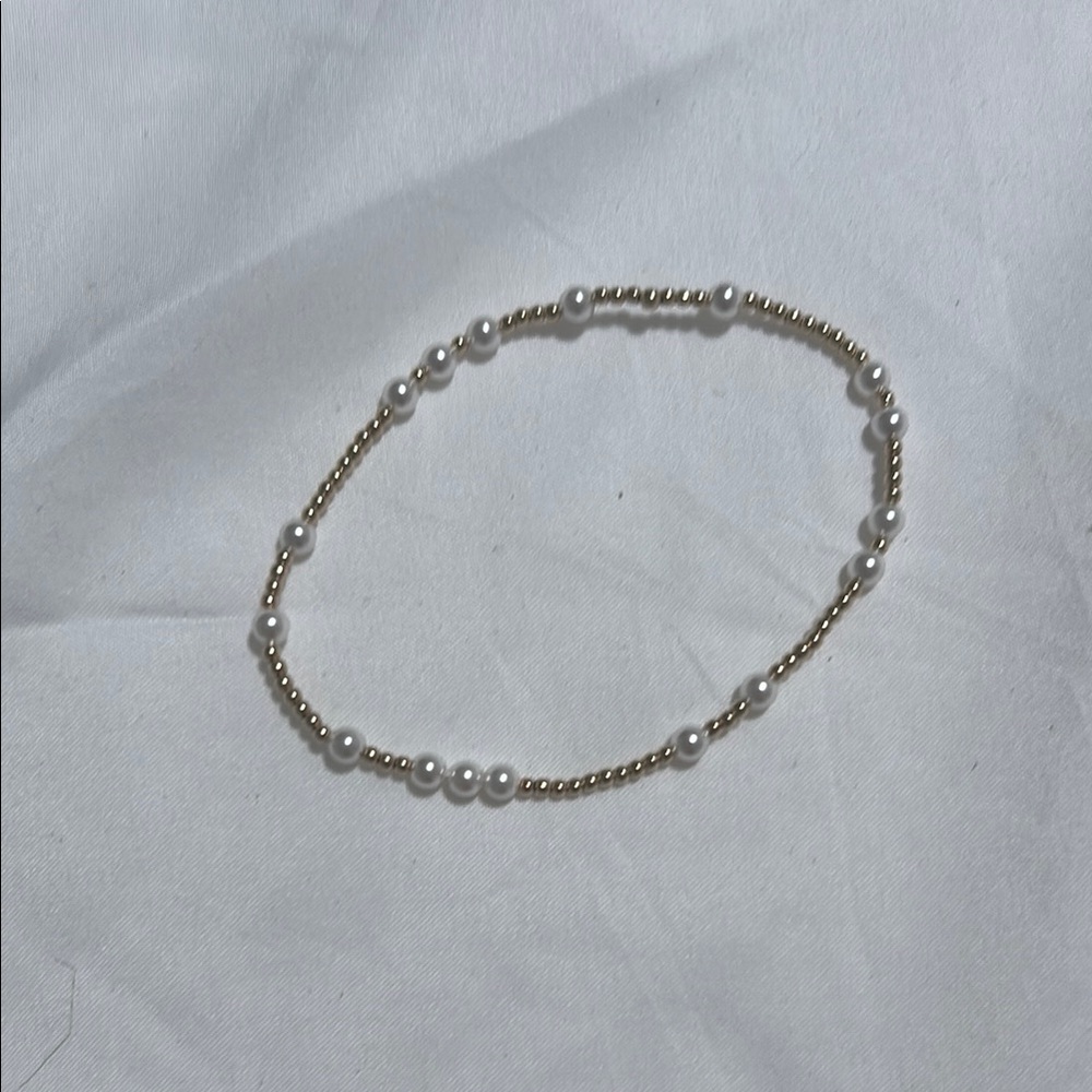 Elegant Gold and White Braided Bracelet
